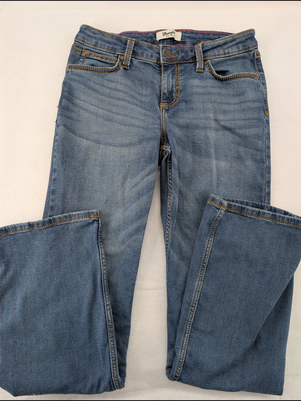 Wrangler Retro jeans, featuring a classic medium wash and a stylish bootcut leg.